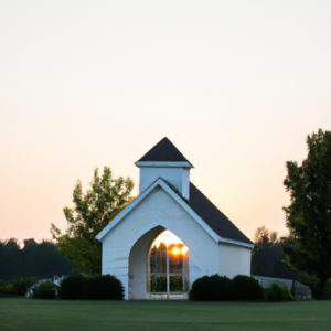 A wedding chapel with a sun setting in the background.