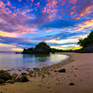A picturesque beach with a colorful sunset sky.