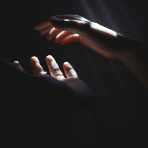 A pair of intertwined hands, one open and one closed, with a light shining between them.