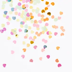 Pastel-colored confetti in the shape of hearts raining down on a white background.